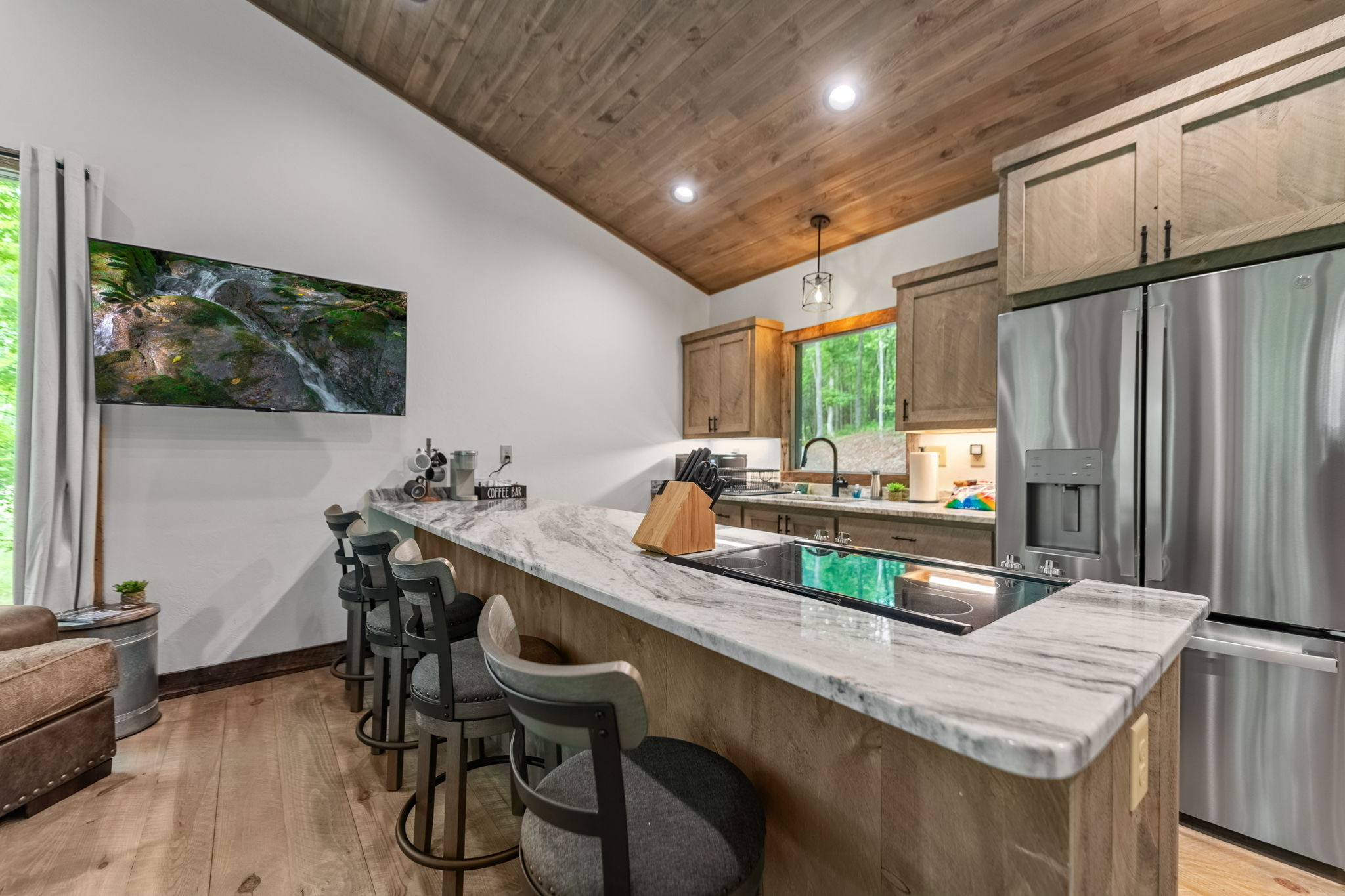 Completed custom mountain home surrounded by wooded North Georgia terrain